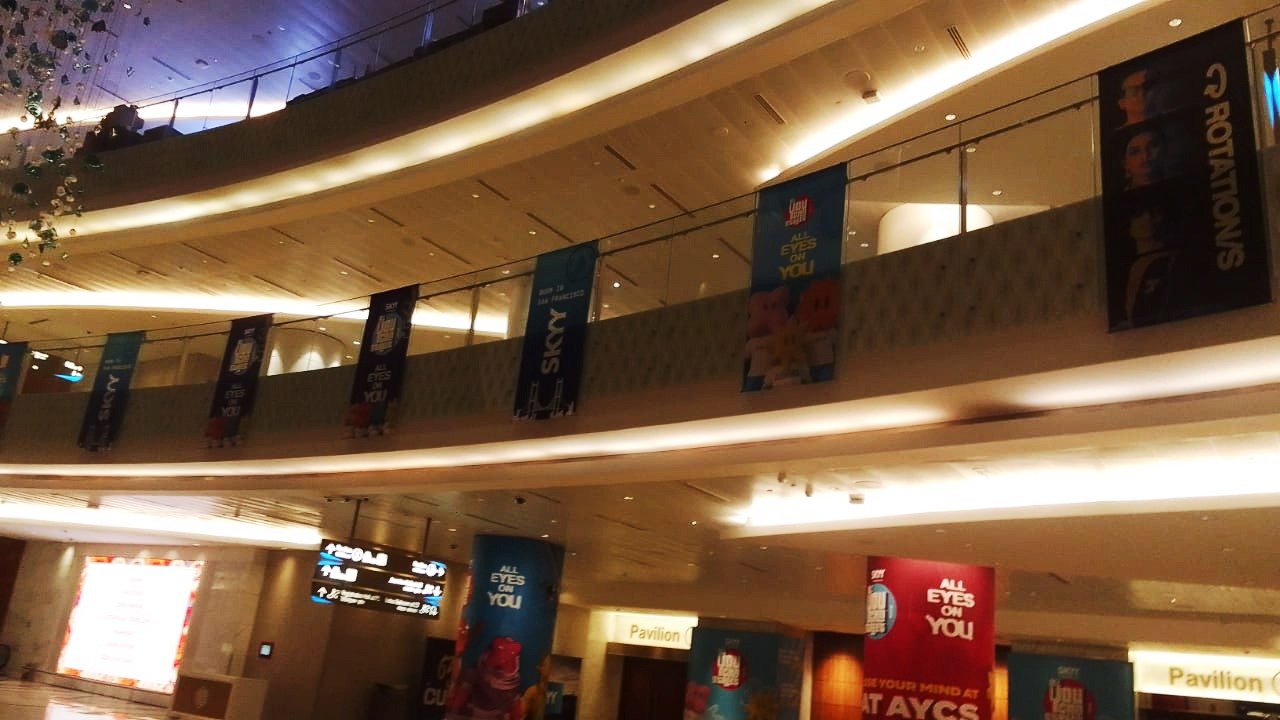 Hanging & Suspended Branding — Suspended banner series running the length of a venue atrium.