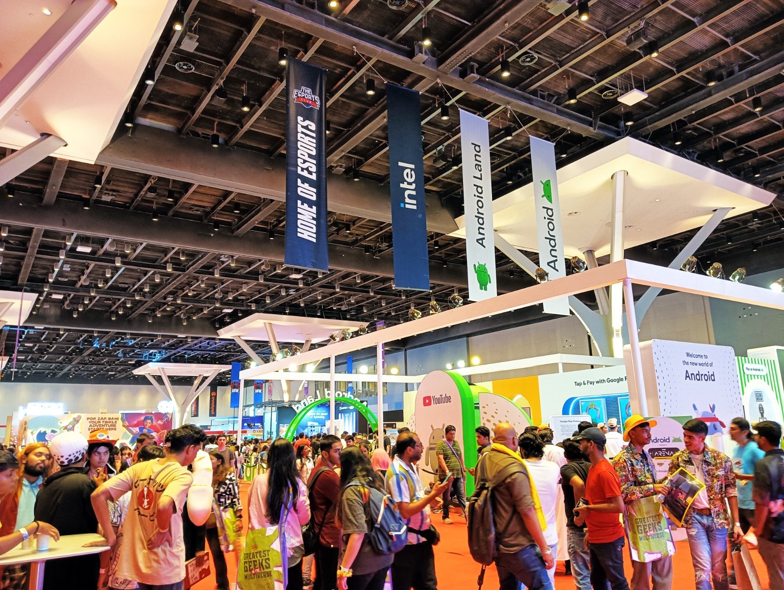 Hall Hanger Branding — Suspended sponsor banners rigged above an exhibition hall.